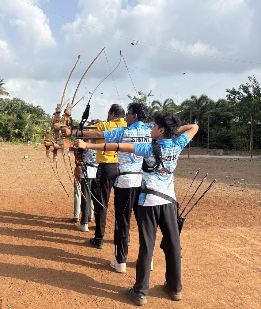 Archer aiming a bow at the Pradnya Archery Academy range
