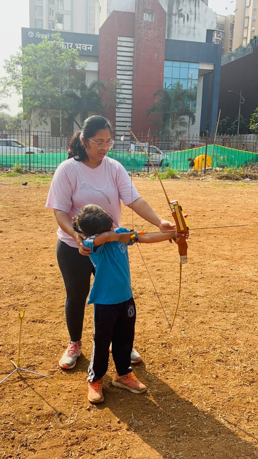 A person holding an archery bow