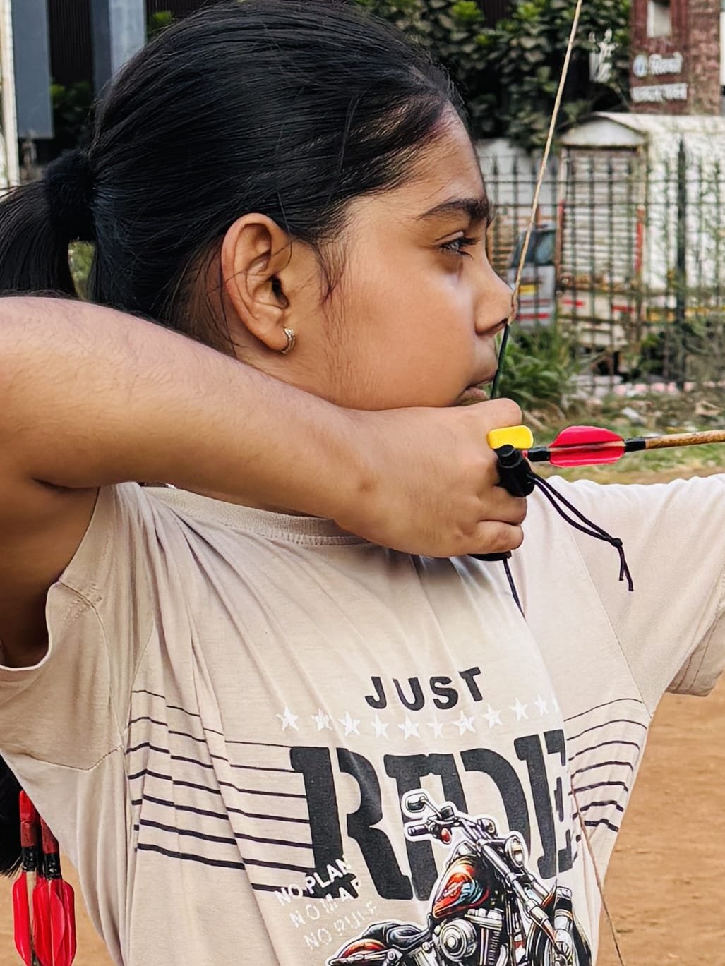 Close-up of an archer aiming at the target