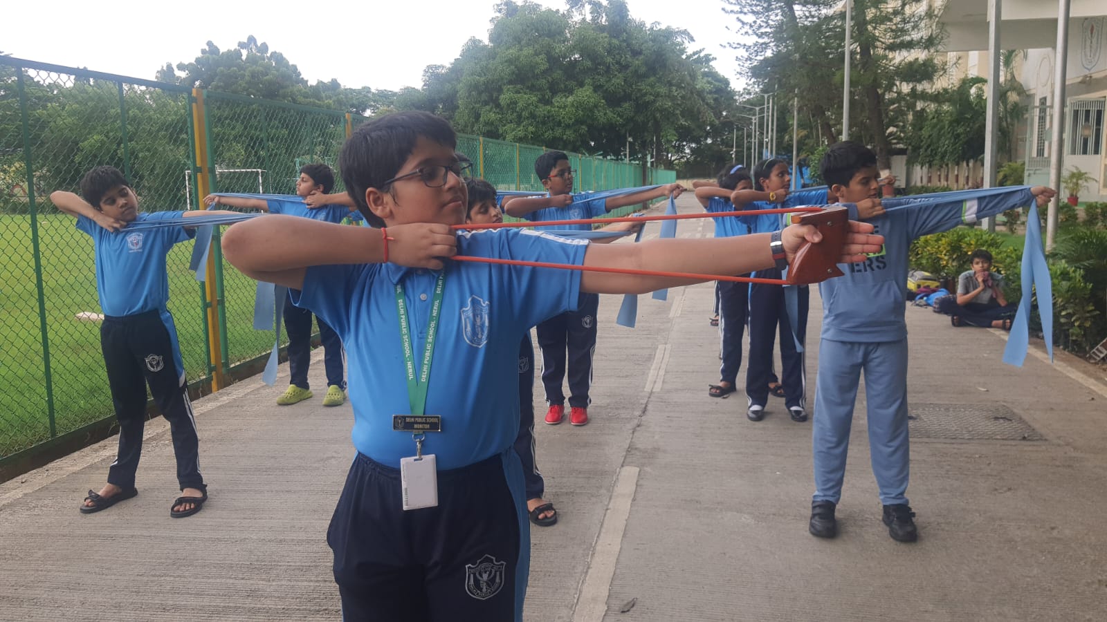 Two archers competing at an academy event
