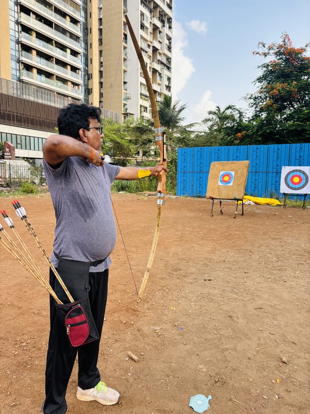 Group of students holding bows on the practice range