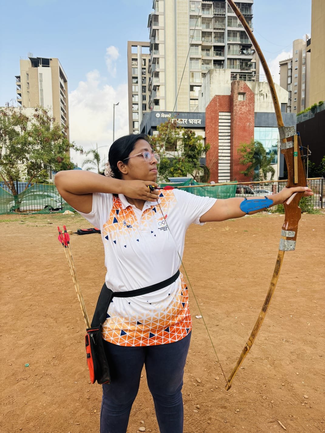 Archer aiming a bow and arrow during training